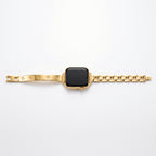 Amore Bangle Band in gold laid flat