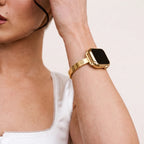 Amore Bangle Band in gold worn on the wrist