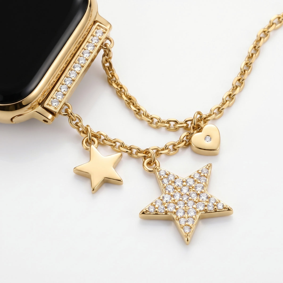 Stellina Charm Band in gold — close-up of the star, heart and pave charms